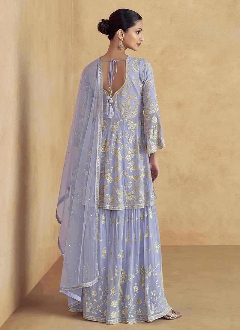 Find occasion-ready Sharara Suit with dupatta and designer details.