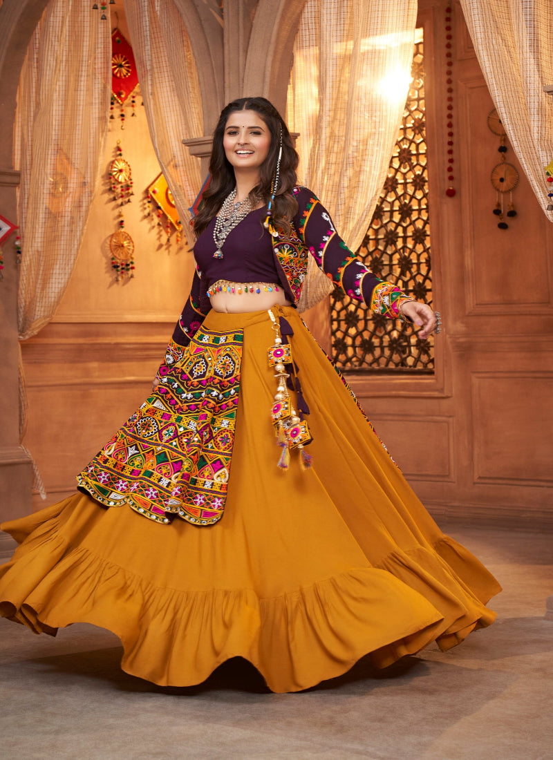 Yellow and Purple Kutchi Chaniya Choli features intricate embroidery and mirror work