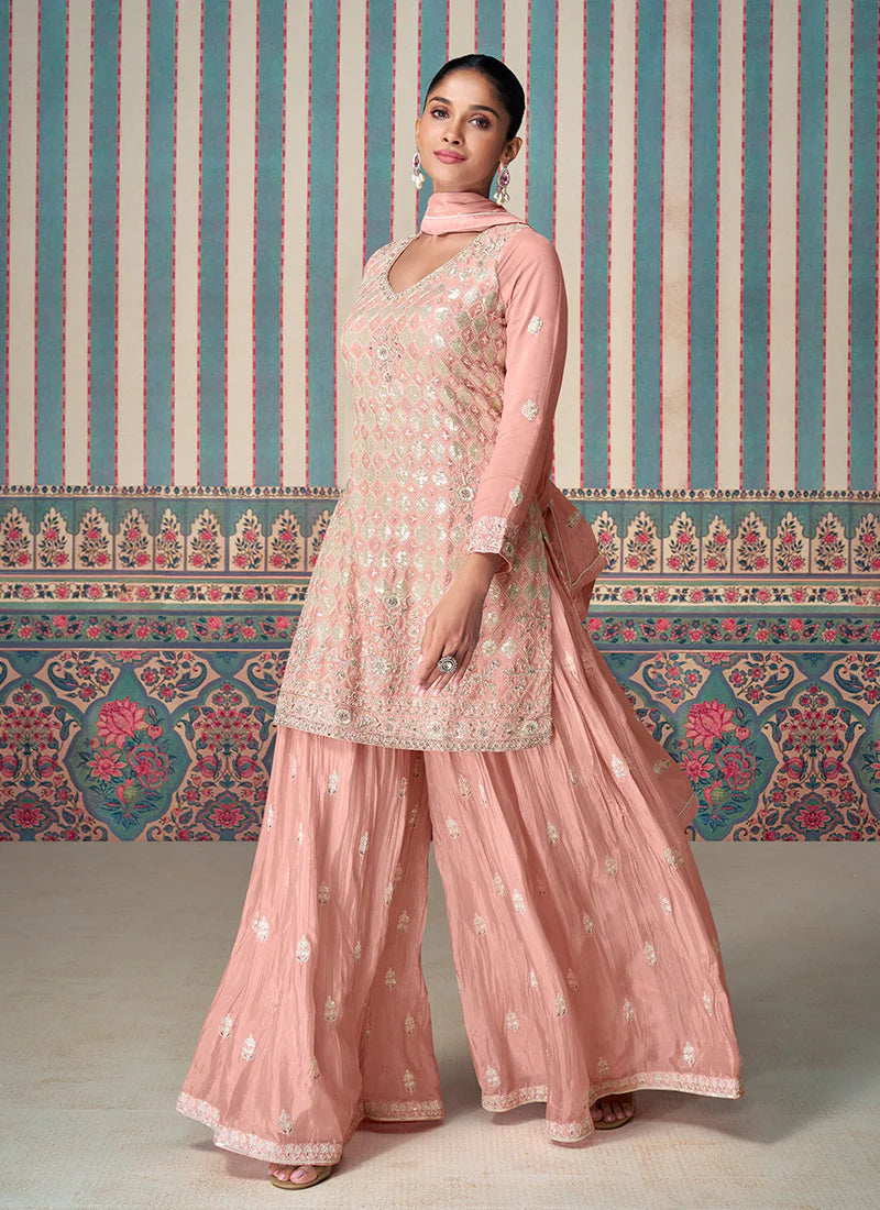 Find occasion-ready Sharara Suit with dupatta and designer details.