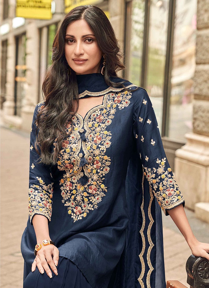 Find occasion-ready Sharara Suit with dupatta and designer details.