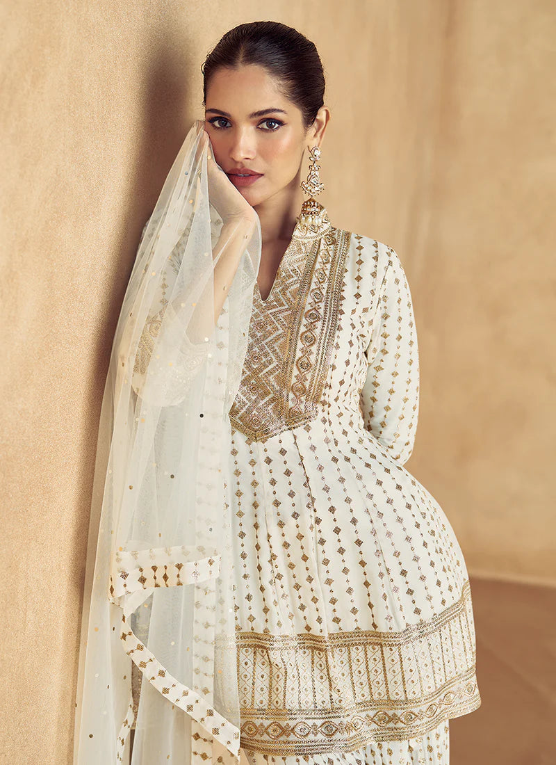 Elegant Off White Embroidered Peplum Sharara Suit