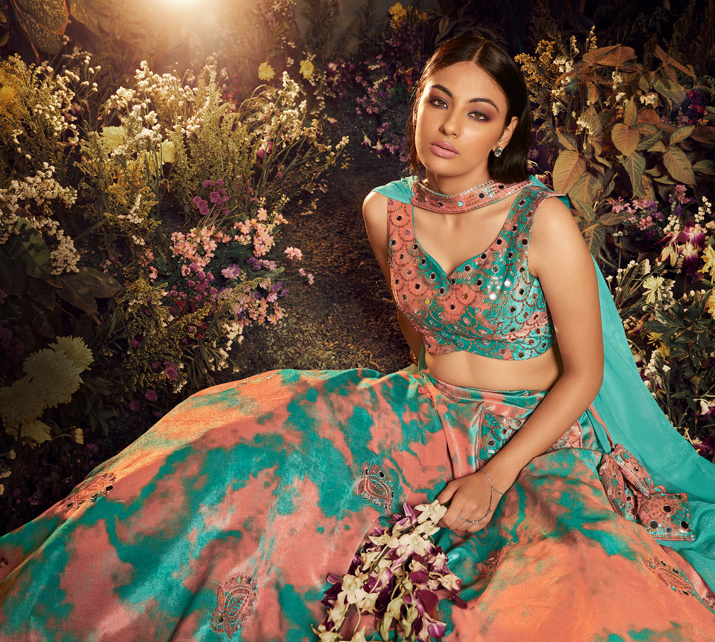 Turquoise Orange Velvet Lehenga Choli features elegant sequin embroidery