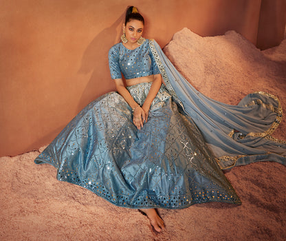 Dusty Sky Mirror Work Lehenga Choli showcases mirror embroidery on velvet