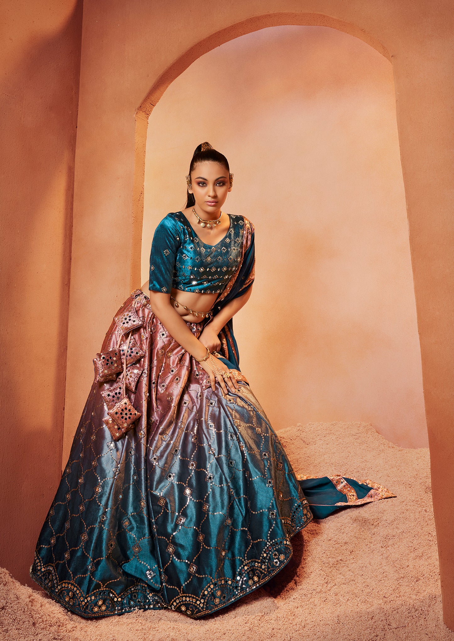 Teal Blue Mirror Work Lehenga Choli showcases mirror embroidery on velvet