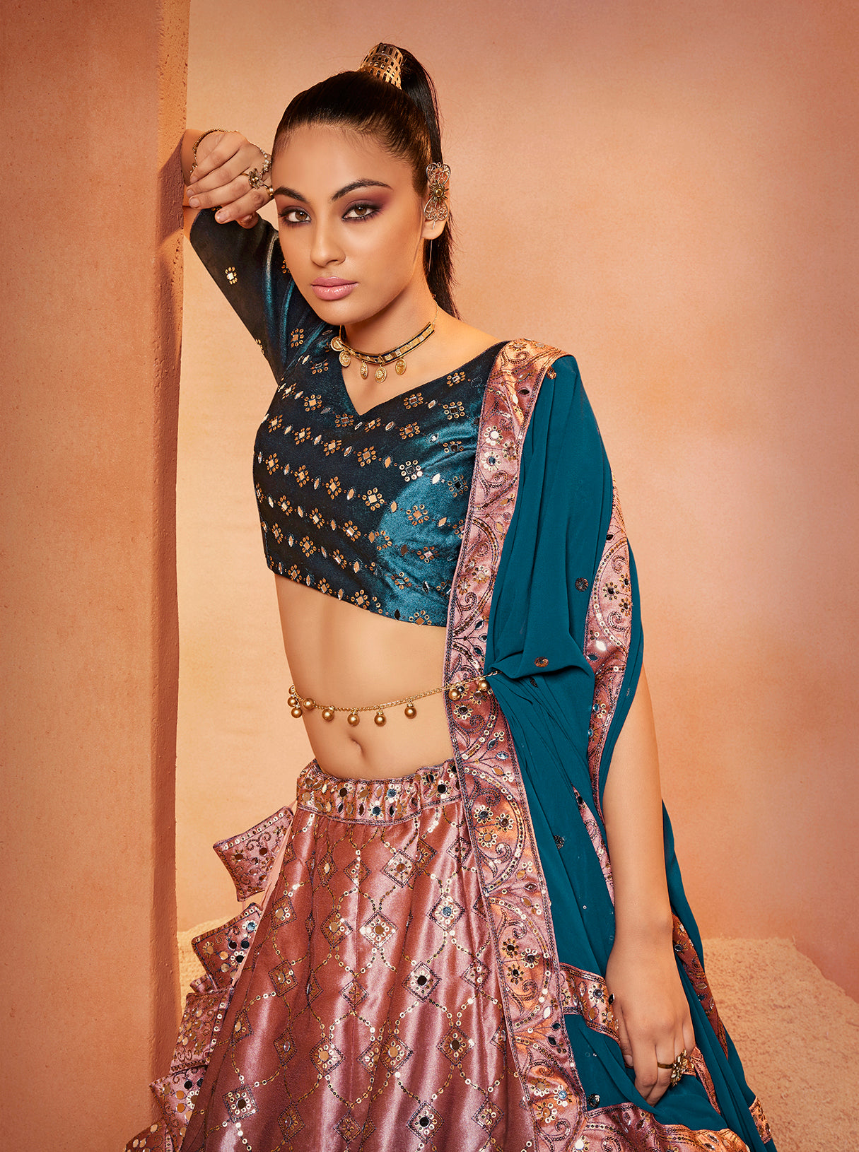 Teal Blue Mirror Work Lehenga Choli showcases mirror embroidery on velvet