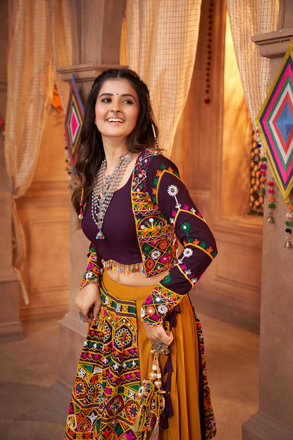 Yellow and Purple Kutchi Chaniya Choli features intricate embroidery and mirror work