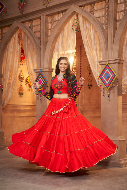 Red Kutchi Chaniya Choli features intricate embroidery and mirror work