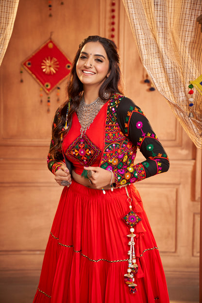 Red Kutchi Chaniya Choli features intricate embroidery and mirror work