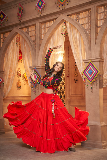 Red Kutchi Chaniya Choli features intricate embroidery and mirror work