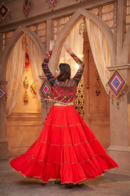 Red Kutchi Chaniya Choli features intricate embroidery and mirror work