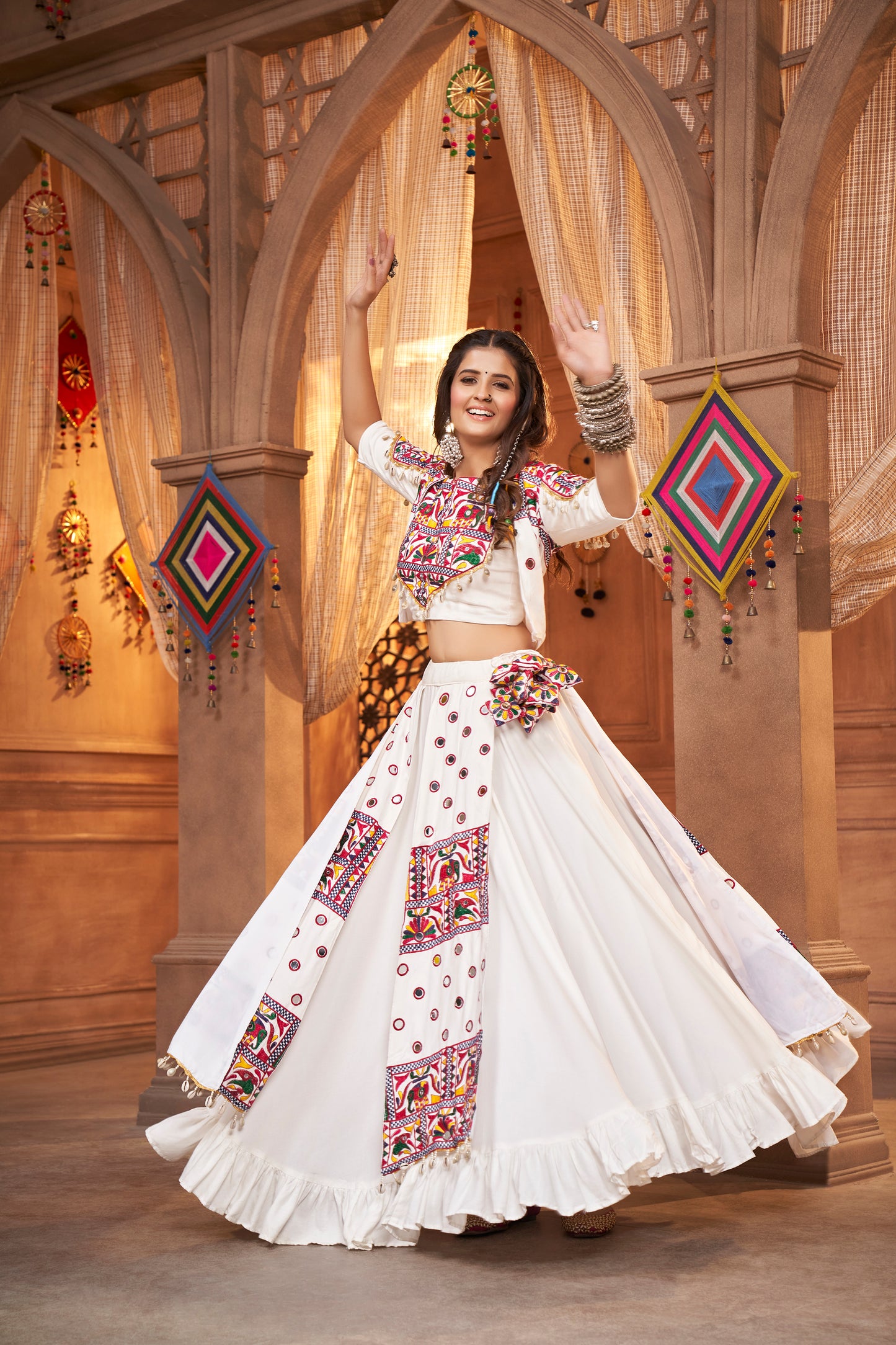 White Kutchi Chaniya Choli features intricate embroidery and mirror work