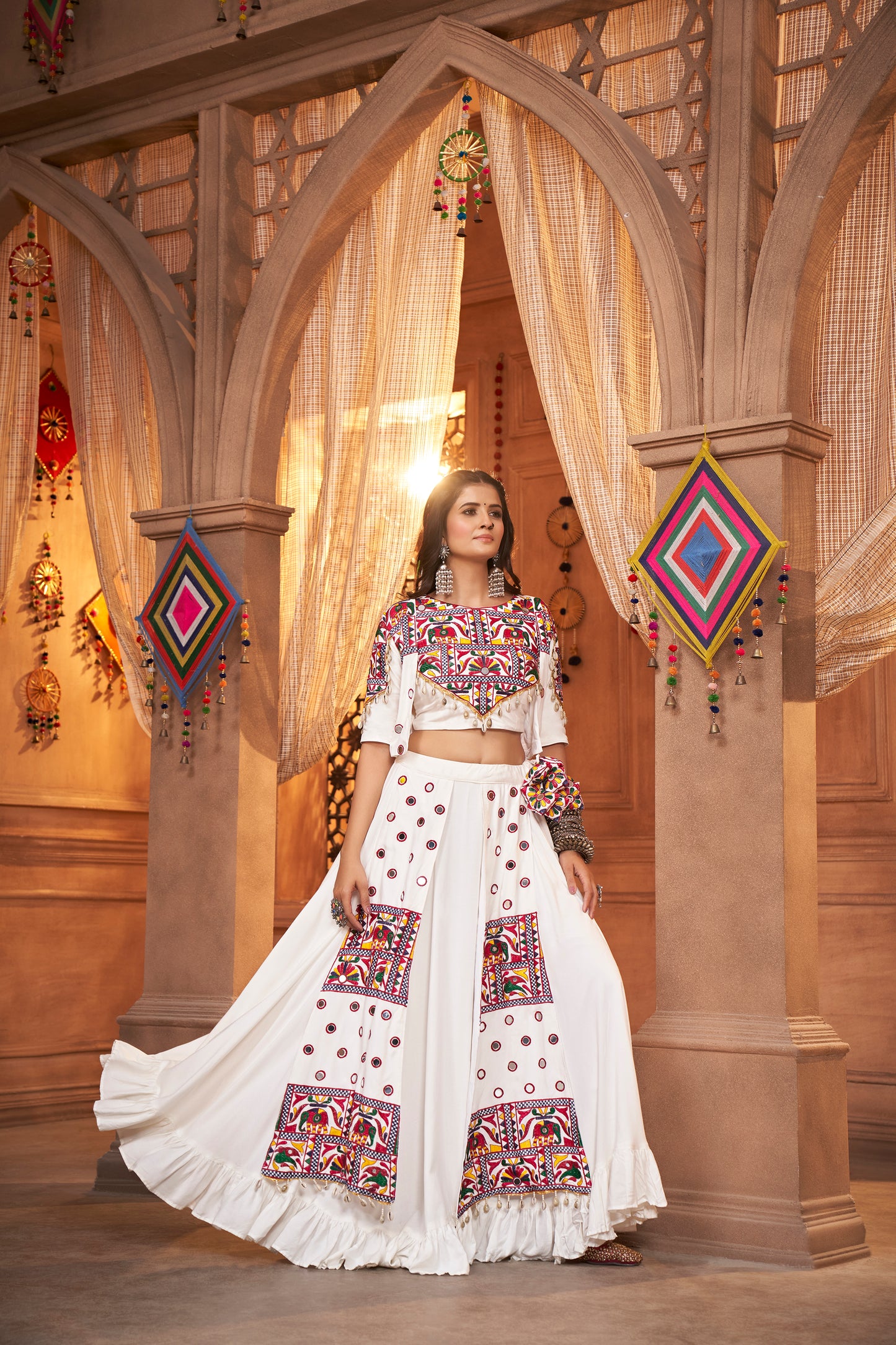 White Kutchi Chaniya Choli features intricate embroidery and mirror work