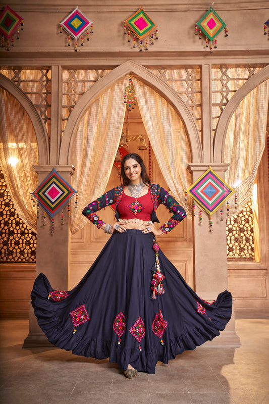 Navy Blue Kutchi Chaniya Choli features intricate embroidery and mirror work.