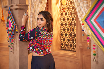 Navy Blue Kutchi Chaniya Choli features intricate embroidery and mirror work.