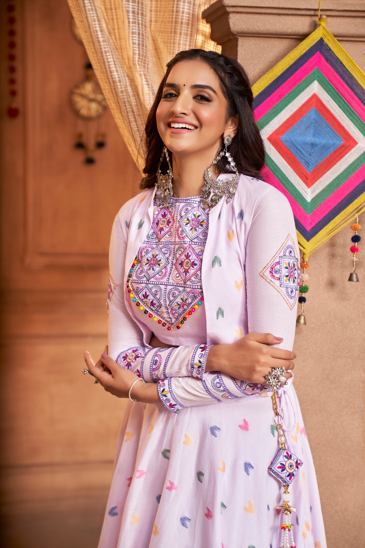 Lilac Kutchi Chaniya Choli features intricate embroidery and mirror work