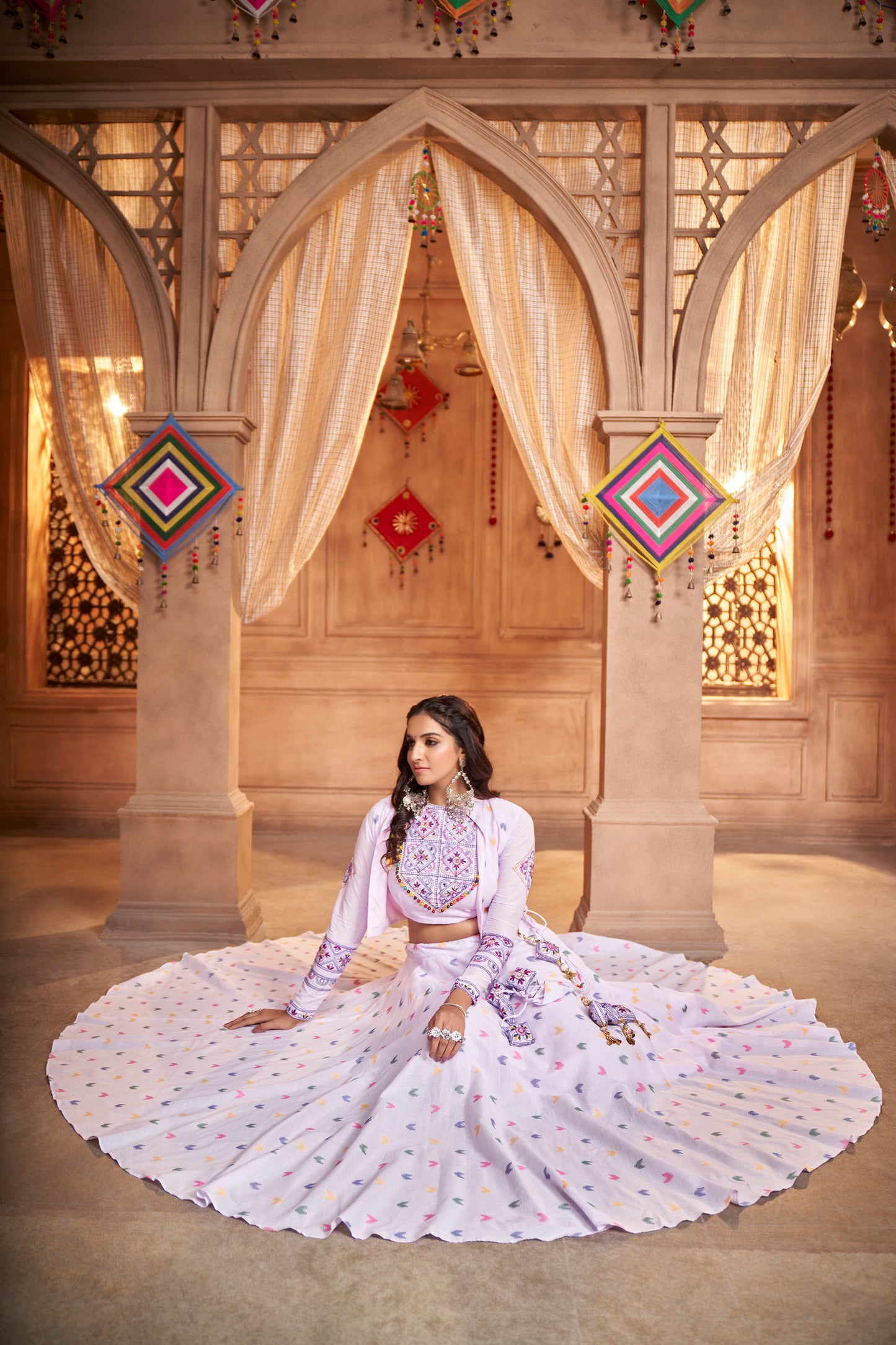 Lilac Kutchi Chaniya Choli features intricate embroidery and mirror work