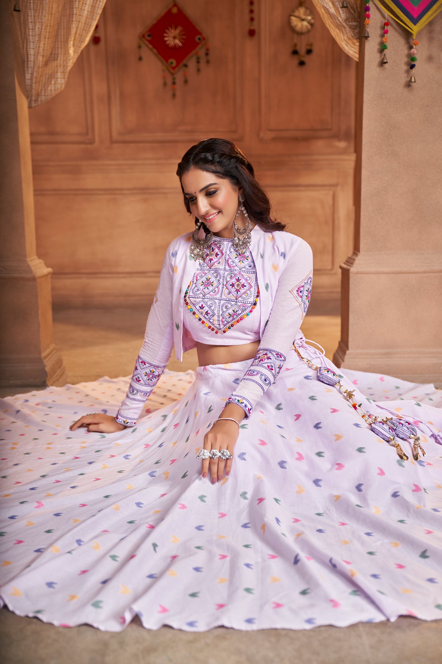 Lilac Kutchi Chaniya Choli features intricate embroidery and mirror work