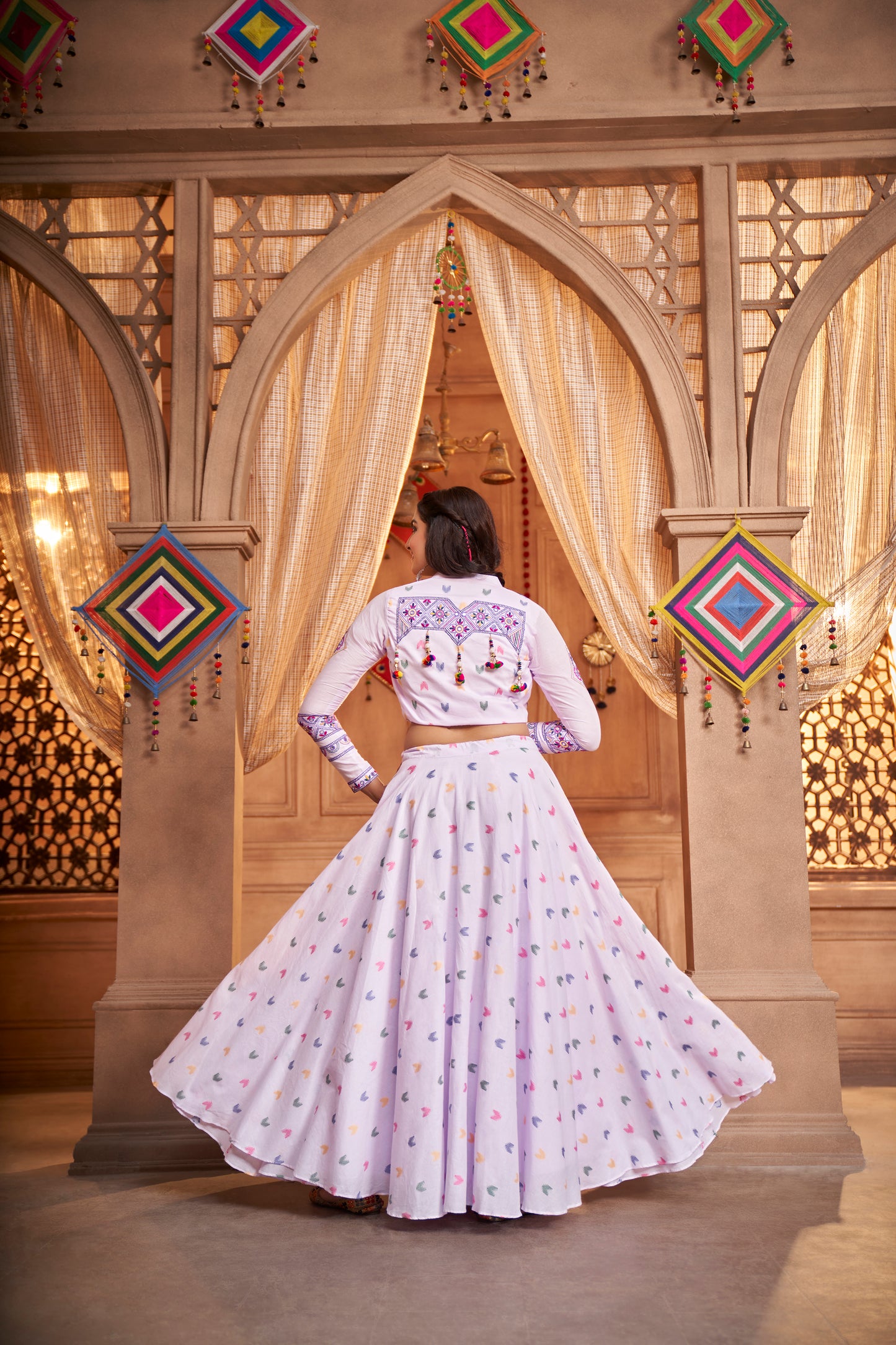 Lilac Kutchi Chaniya Choli features intricate embroidery and mirror work