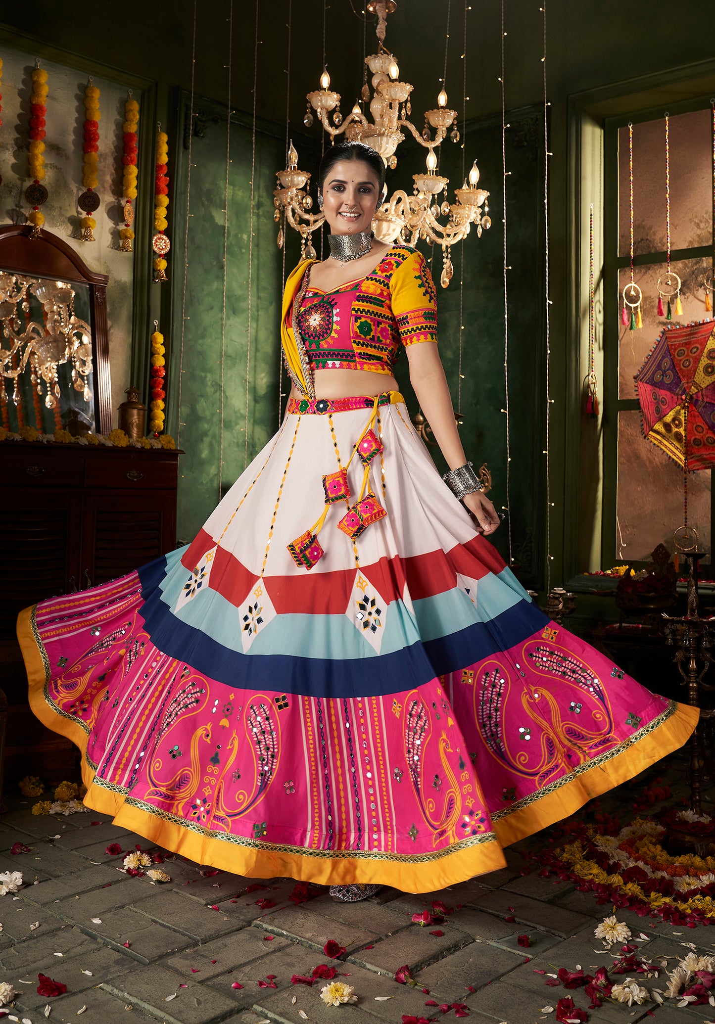 Multicolor printed ghagra choli with traditional mirror work, ideal for Navratri celebrations