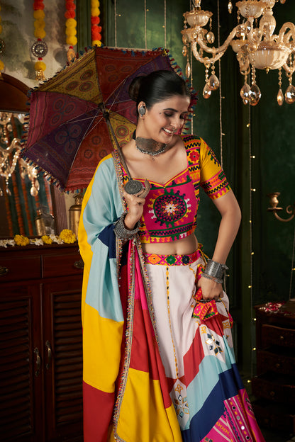 Multicolor printed ghagra choli with traditional mirror work, ideal for Navratri celebrations