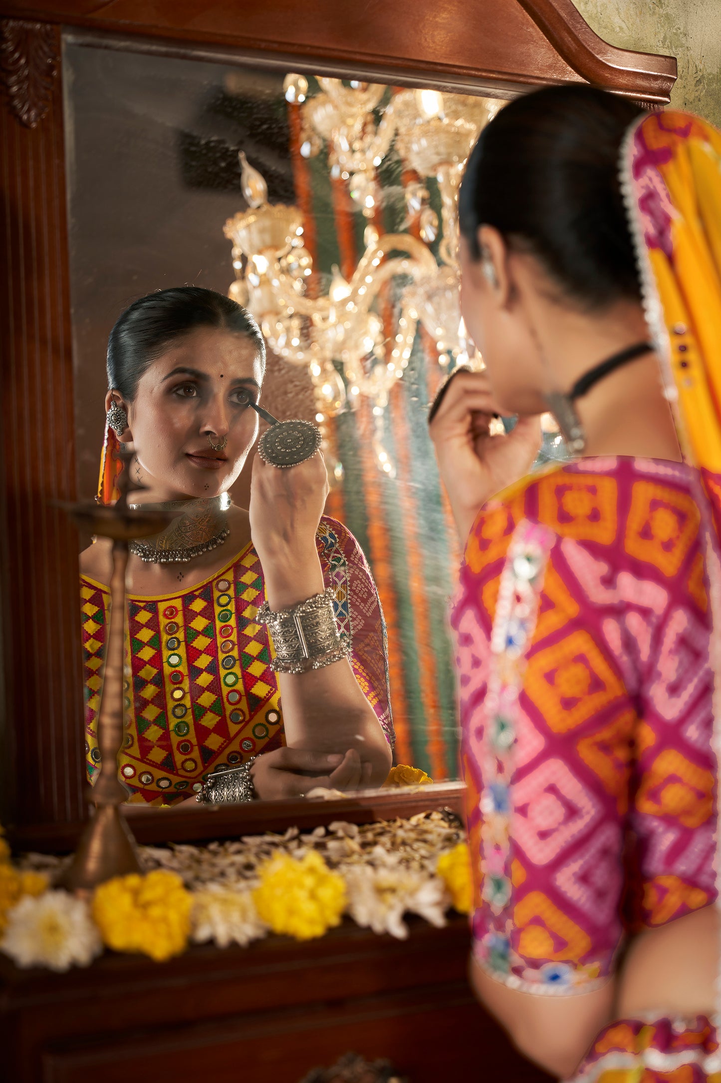 Yellow ghagra choli with traditional mirror work, ideal for Navratri celebrations