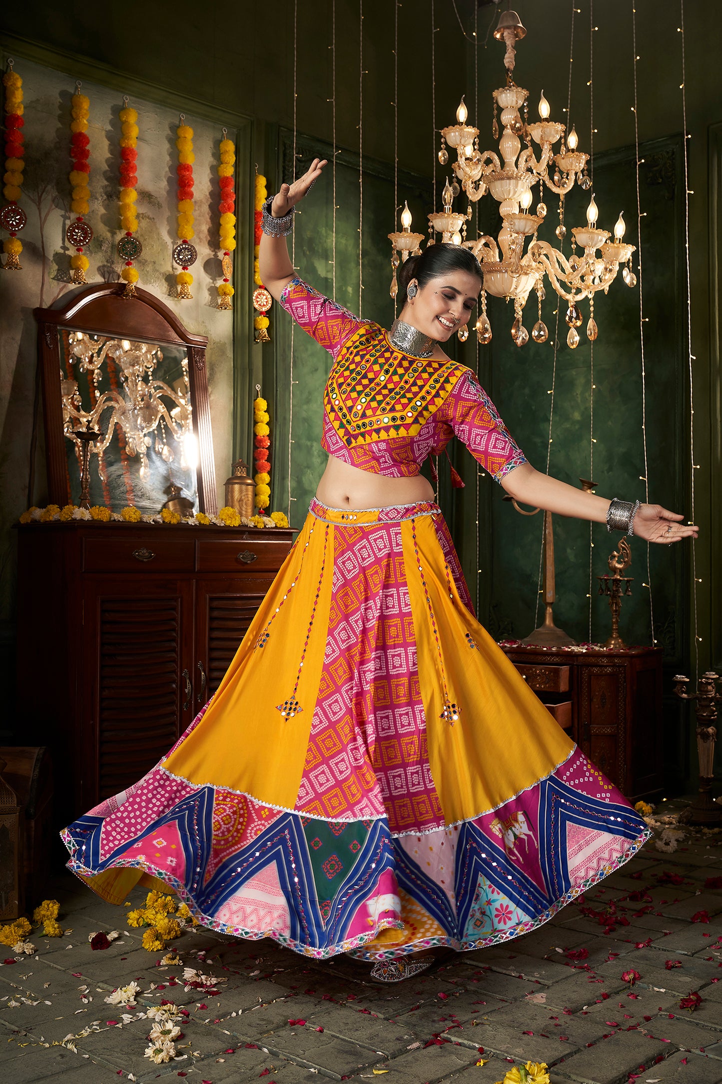 Yellow ghagra choli with traditional mirror work, ideal for Navratri celebrations