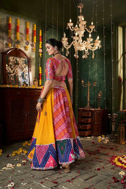 Yellow ghagra choli with traditional mirror work, ideal for Navratri celebrations