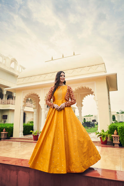 Mustard Yellow Anarkali Gown with Jacket features sequin and resham embroidery