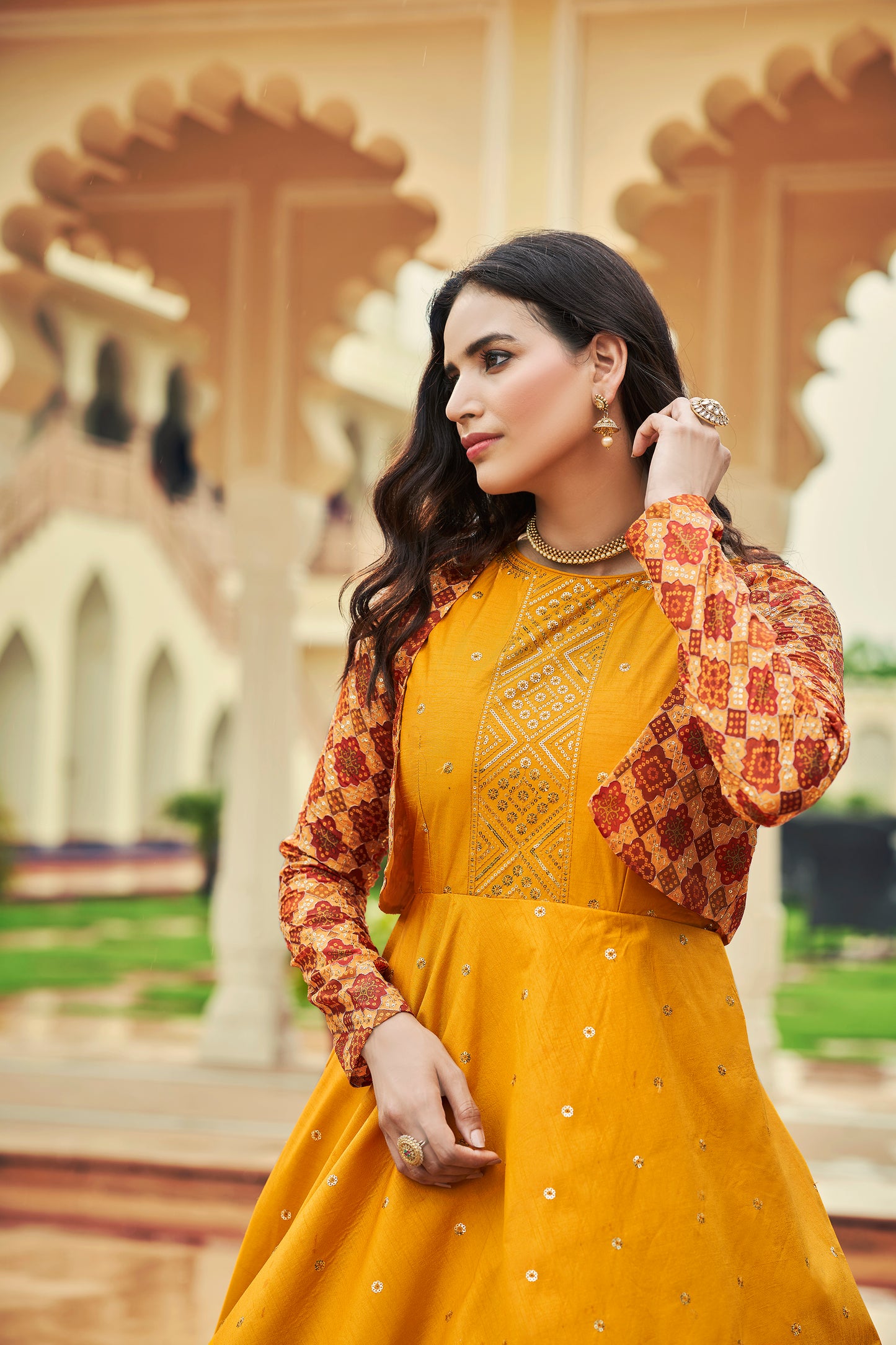 Mustard Yellow Anarkali Gown with Jacket features sequin and resham embroidery