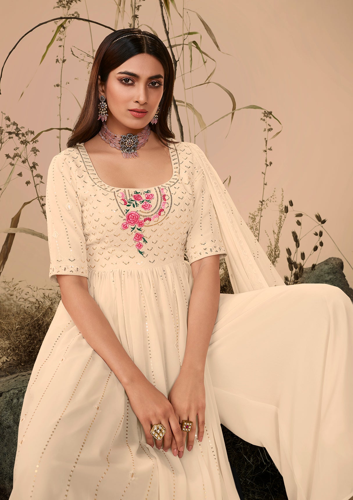 Off White Georgette Embroidered Kurta Palazzo Set features detailed embroidery