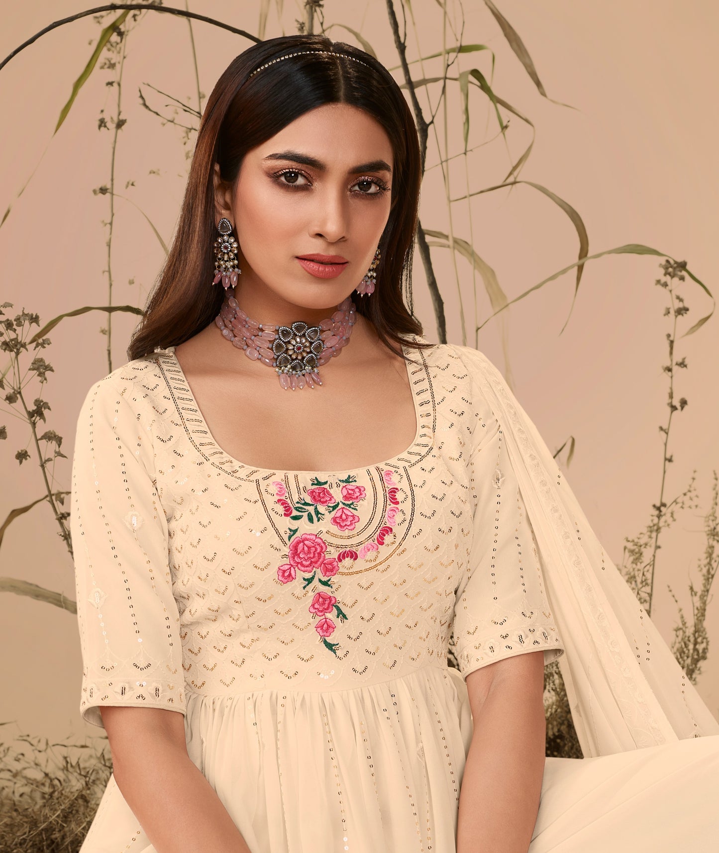 Off White Georgette Embroidered Kurta Palazzo Set features detailed embroidery