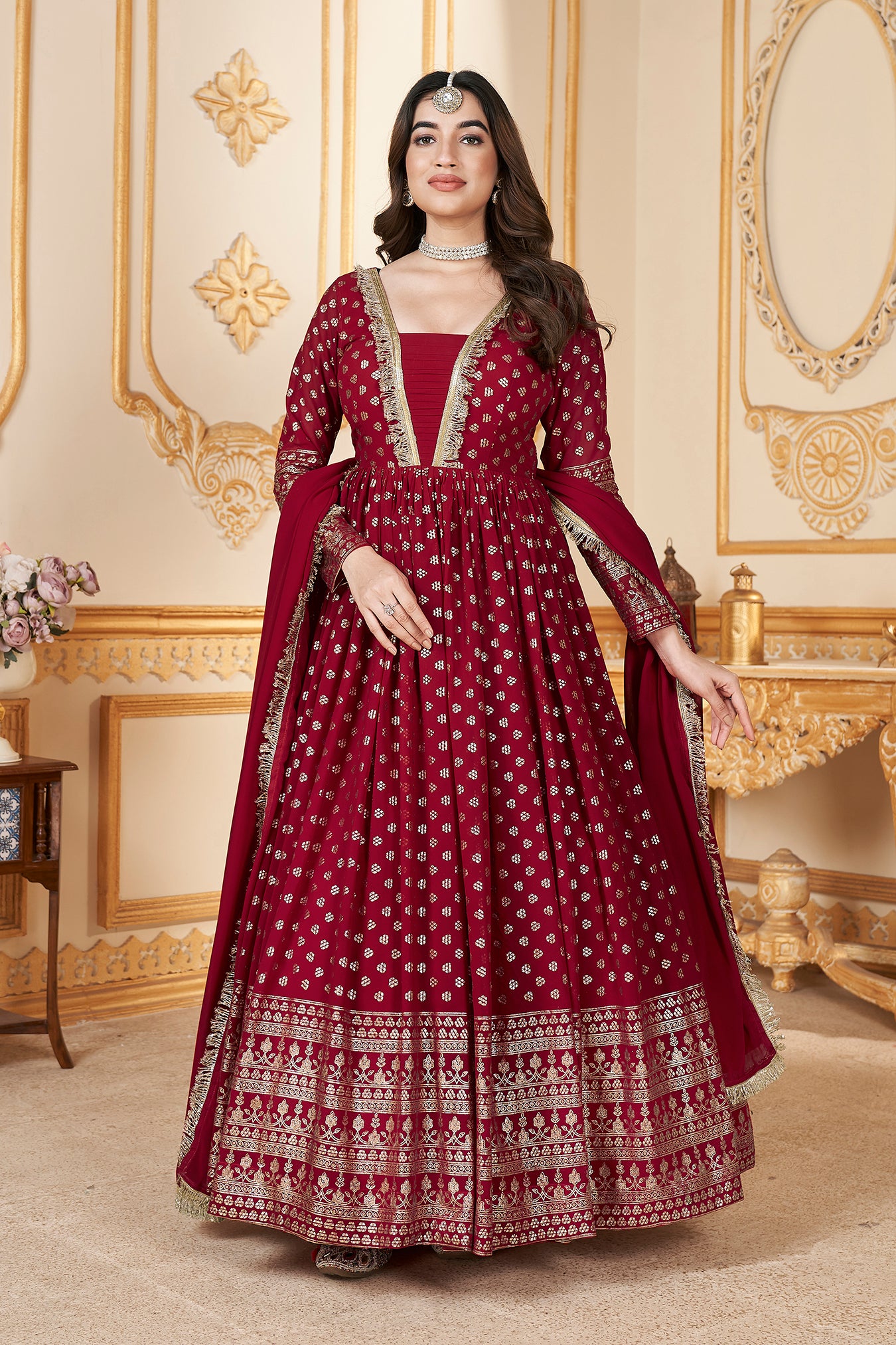 Red Anarkali gown with metallic foil accents and matching dupatta