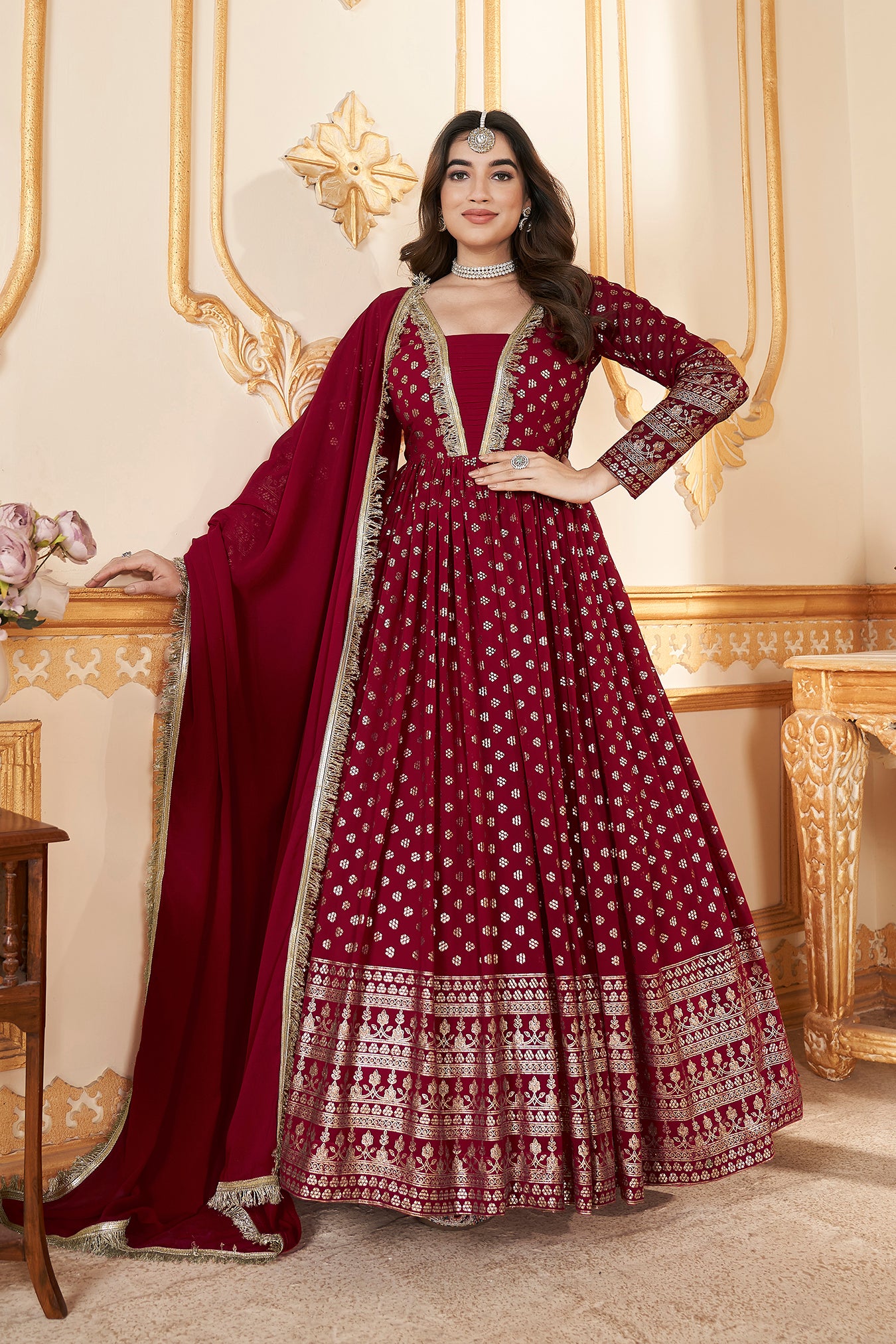 Red Anarkali gown with metallic foil accents and matching dupatta