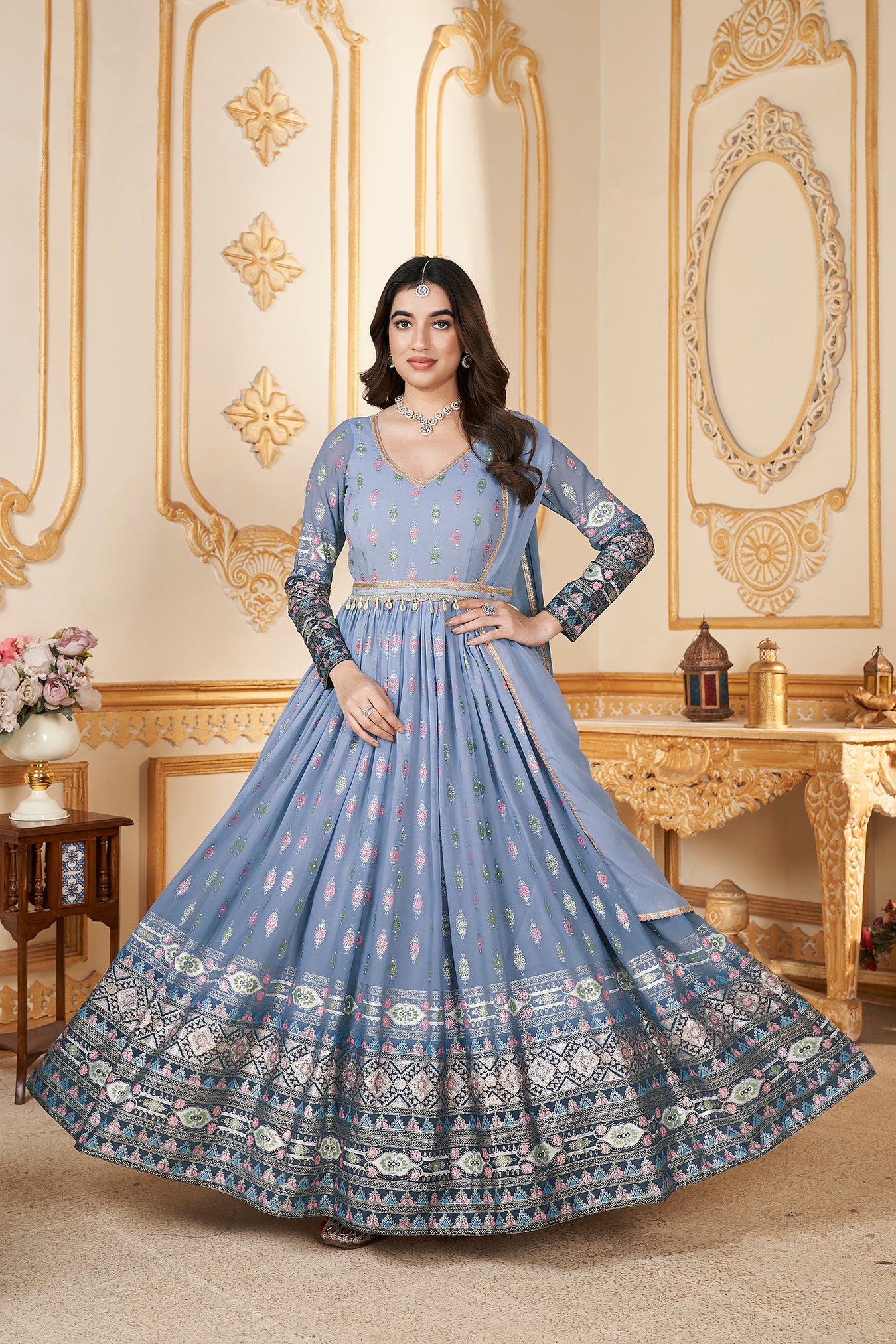 Blue Anarkali gown with metallic foil accents and matching dupatta.