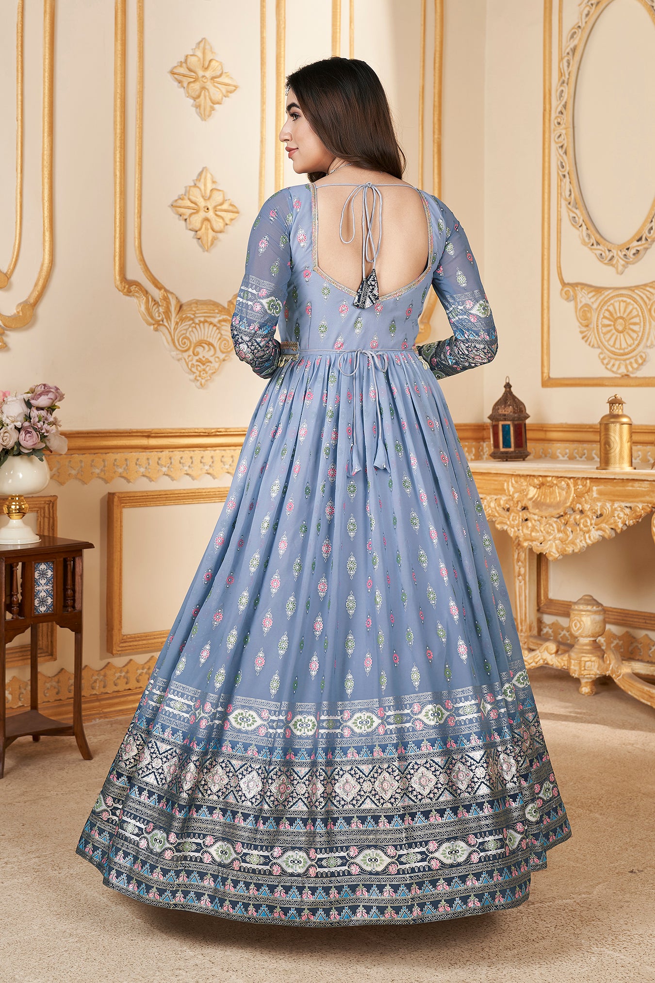 Blue Anarkali gown with metallic foil accents and matching dupatta.