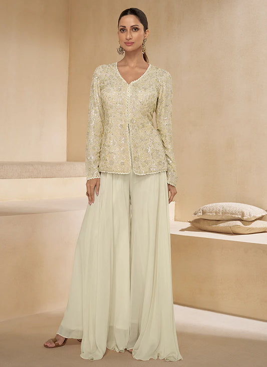 Cream Multicoloured Sharara Suit features vibrant embroidery and a flared bottom