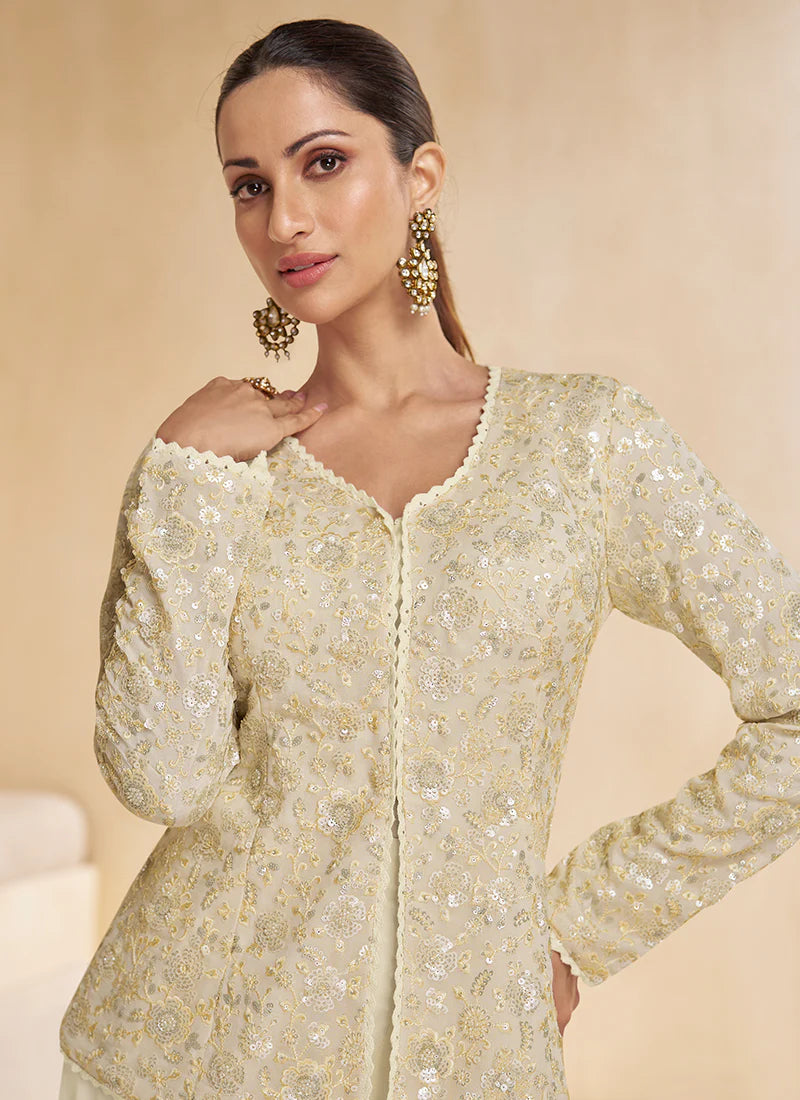 Cream Multicoloured Sharara Suit features vibrant embroidery and a flared bottom